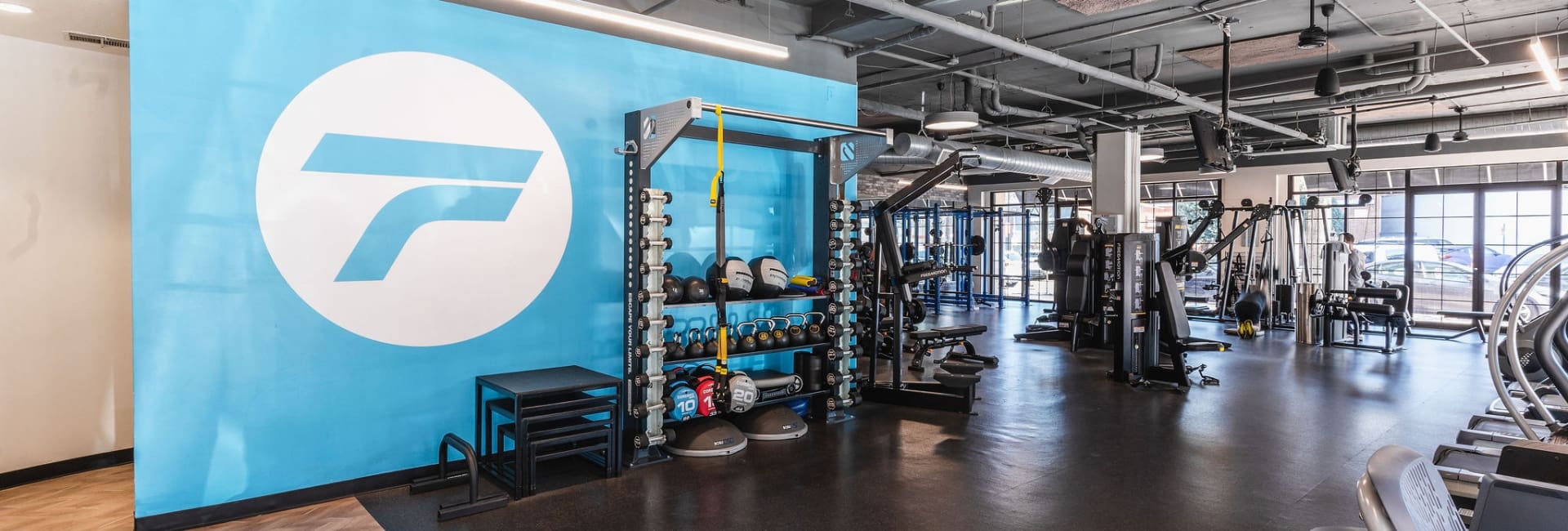 a spacious strength training area at freedom fitness gym in dallas texas near me