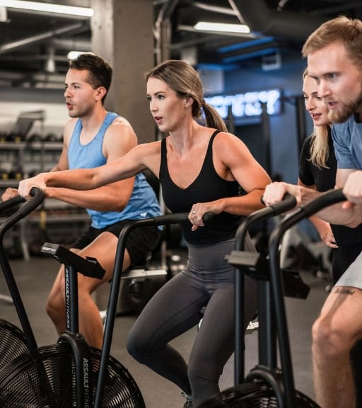 gym members use cardio equipment at trophy fitness gym near me in dallas texas