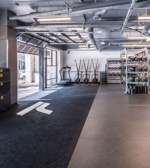 a spacious functional training turf area at a gym near me